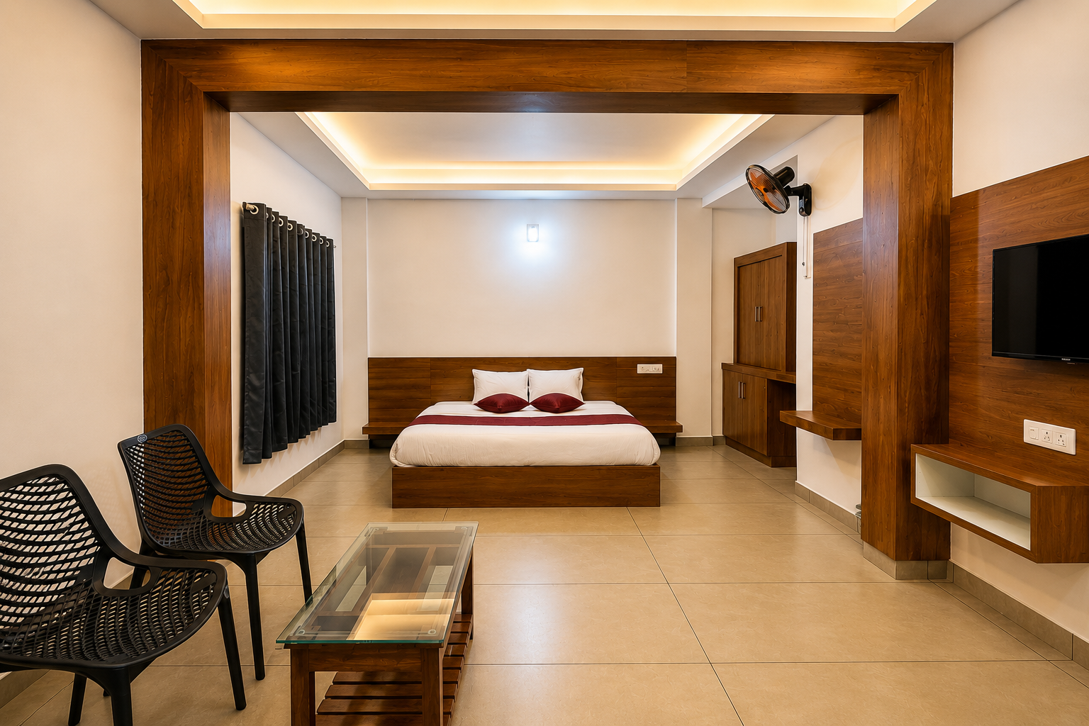 Aysh Lux Haven Non-AC Room Grand Suite Layout with Lounge Seating and Master Bed in Wayanad